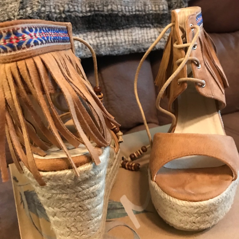 Cute, tan, fringed wedges